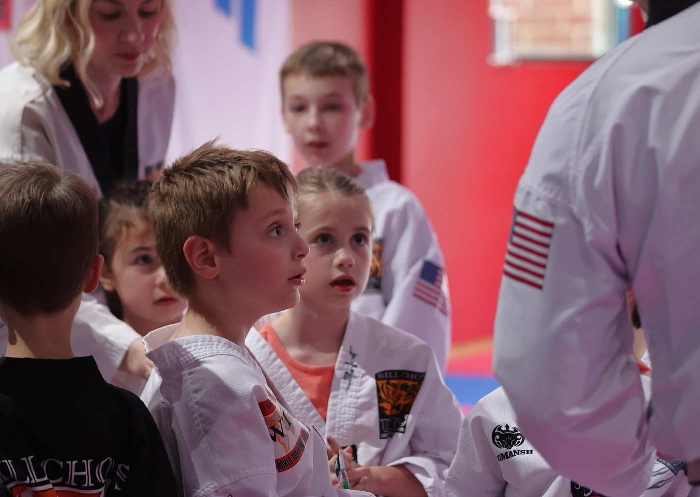 Young students at Bill Cho's listening attentively to their instructor