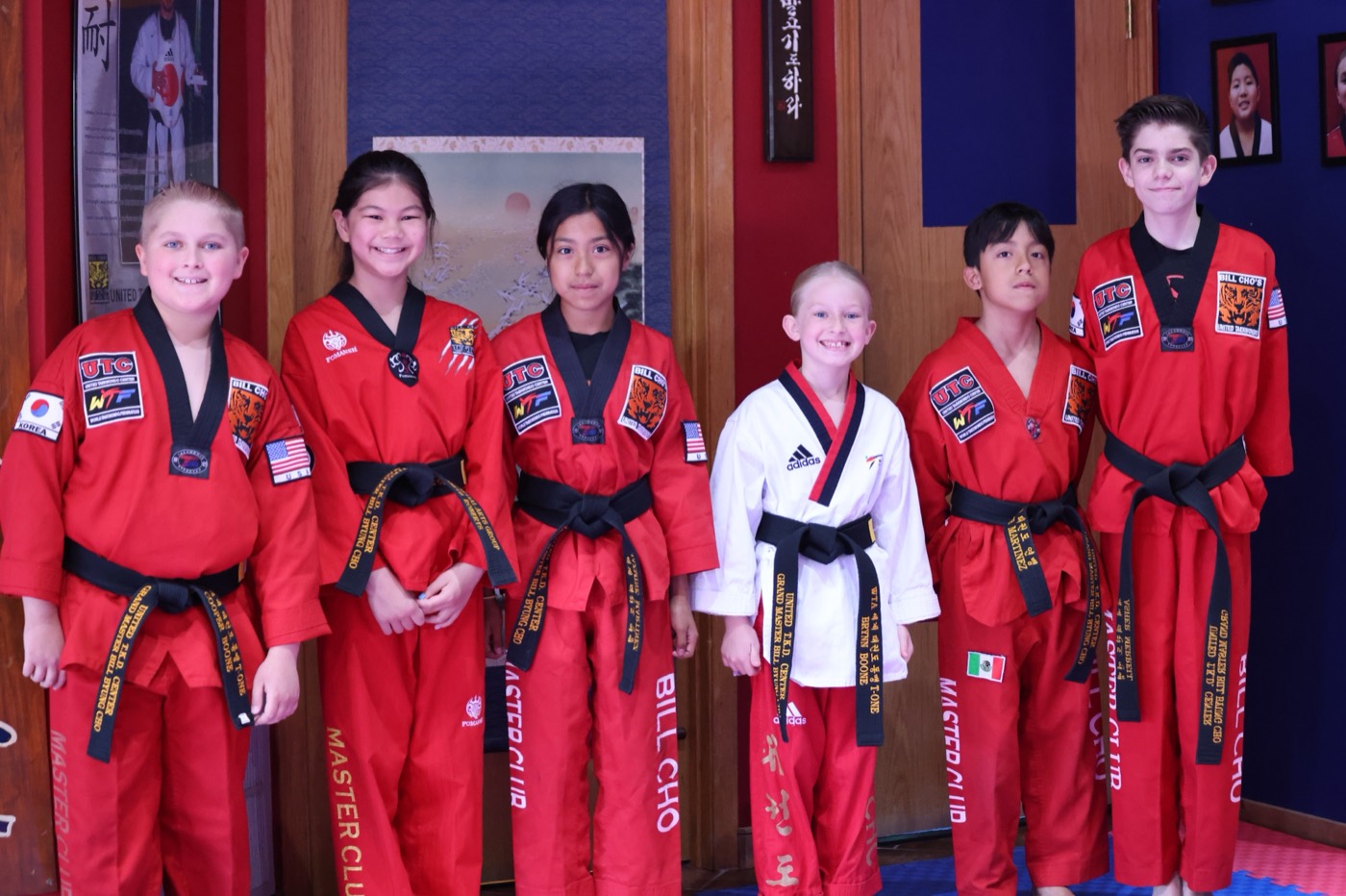 Bill Cho's Master Club members lined up in their red MASTER CLUB doboks with black belts